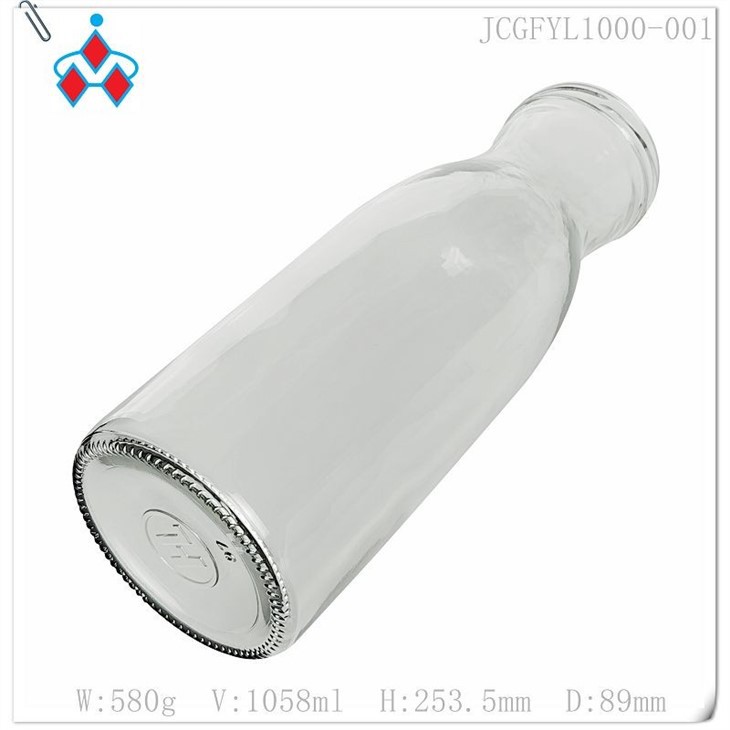 Glass orange juice bottle in stock