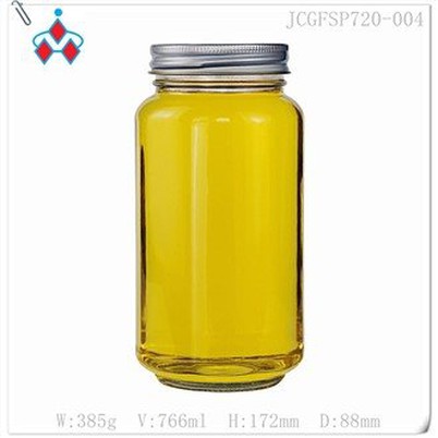 pequeños tarros de miel de vidrio